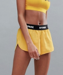 Ivy Park - Active - Short tissé à bandes et logo - Jaune