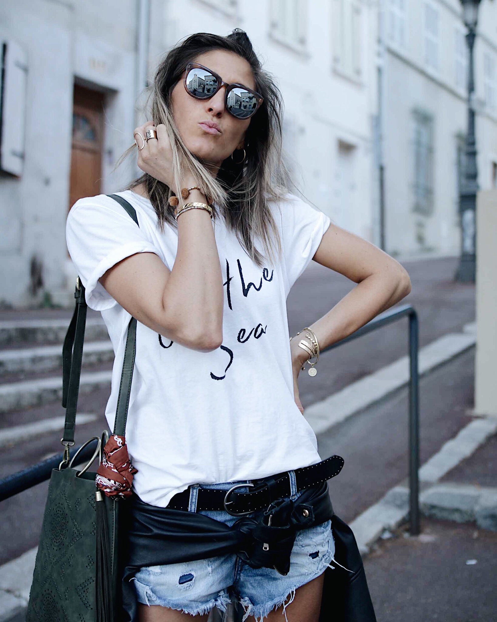 casual look with white tee-shier and denim shorts; fur converse and anthropologie bag